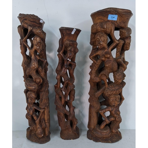 134 - Three African style tribal wooden carving figure statues, largest 63cmh, smallest 55cmh
Location:RAM... 