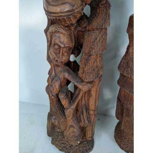 134 - Three African style tribal wooden carving figure statues, largest 63cmh, smallest 55cmh
Location:RAM... 