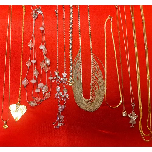 114 - A large quantity of modern fashion jewellery to include gold tone chains, a Trifari gold tone heart ... 