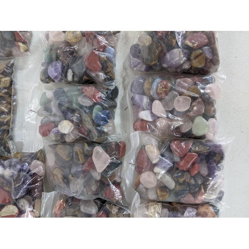 136 - Fourteen bags of semi precious stones to include tiger eye, aquamarines and others
Location:A1M
If t... 