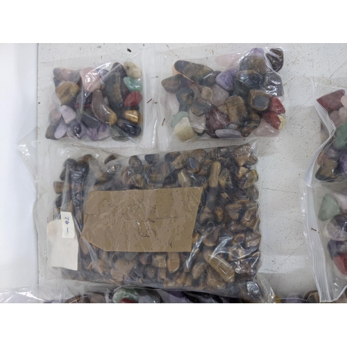 136 - Fourteen bags of semi precious stones to include tiger eye, aquamarines and others
Location:A1M
If t... 