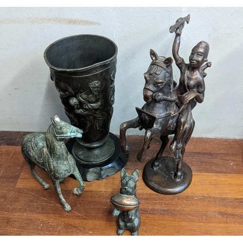 14 - An African brass sculpture of a horse warrior, a vintage bronze horse, a scotty dog figurine and a b... 