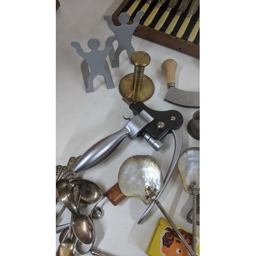 145 - Mixed flatware and cutlery to include two canteens, a pair of shell salad servers, nut crackers and ... 