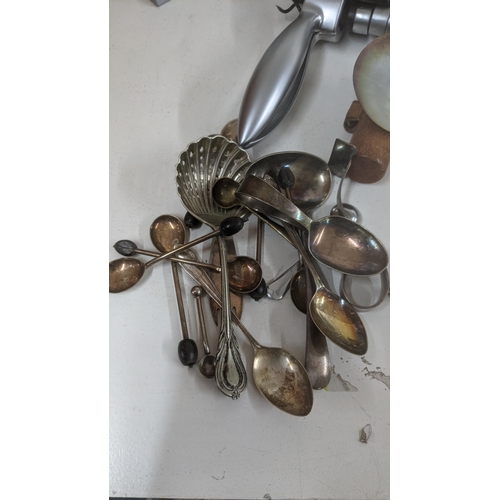 145 - Mixed flatware and cutlery to include two canteens, a pair of shell salad servers, nut crackers and ... 