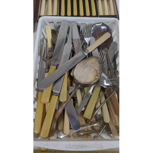 145 - Mixed flatware and cutlery to include two canteens, a pair of shell salad servers, nut crackers and ... 