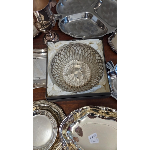 185 - A collection of silver plate to include trays, dishes, goblets, souvenir spoons and other items
Loca... 