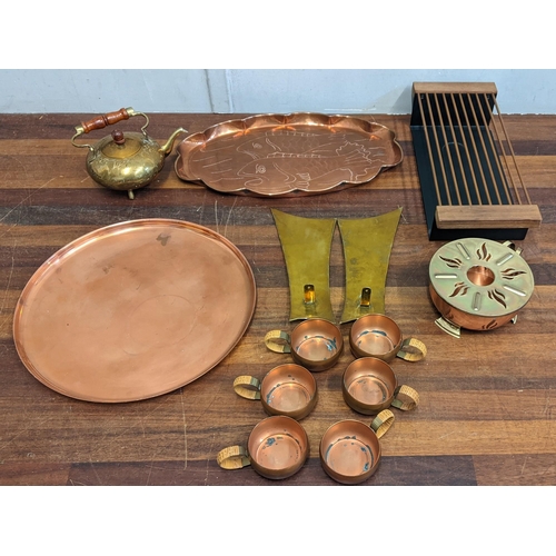 190 - A collection of metalware to include a brass kettle, copper trays, a hot plate and other items
Locat... 