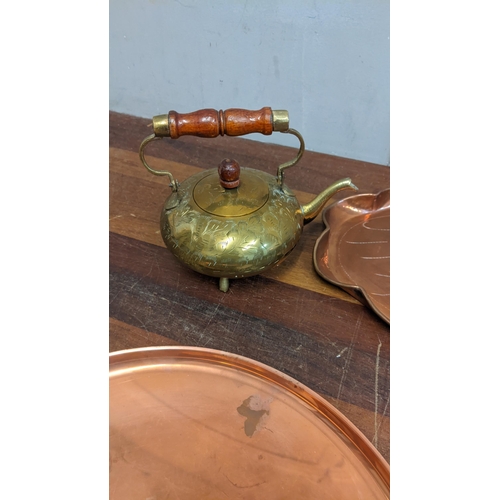 190 - A collection of metalware to include a brass kettle, copper trays, a hot plate and other items
Locat... 