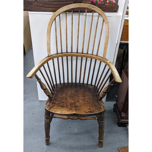 205 - A 19th century Windsor hoop back arm chair having an ash frame with spindle supports
Location: STAIR... 