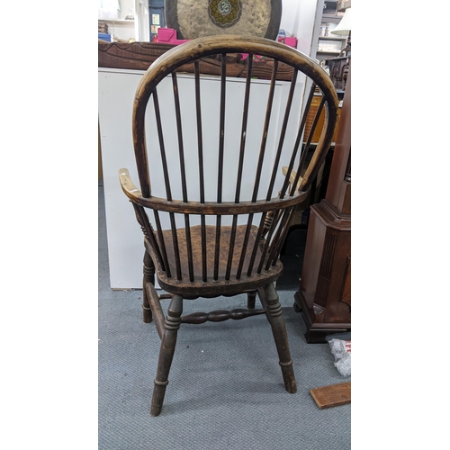 205 - A 19th century Windsor hoop back arm chair having an ash frame with spindle supports
Location: STAIR... 