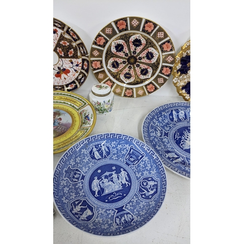 209 - A mixed lot to include a sevres style cabinet plate, Coalport hand painted plate, two Derby plates a... 