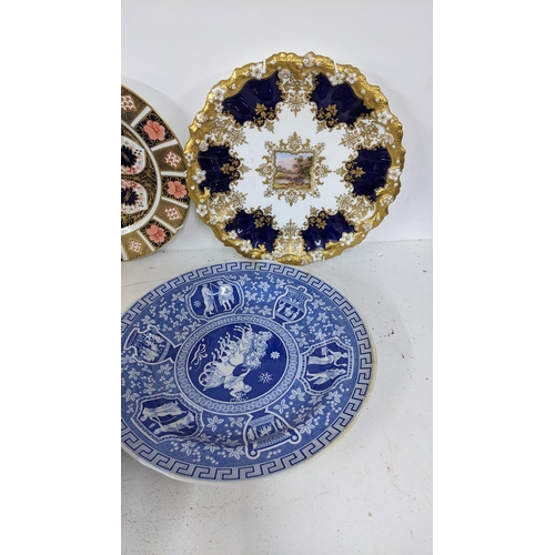 209 - A mixed lot to include a sevres style cabinet plate, Coalport hand painted plate, two Derby plates a... 