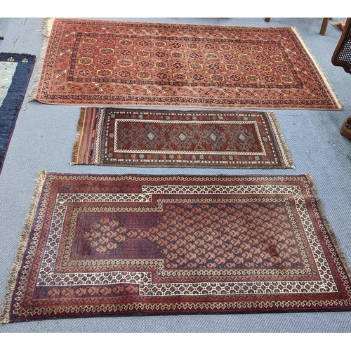 230 - Three hand woven rugs to include an Afghanistan small rug, 117cm x 55cm, a Balouch design rug, 138cm... 