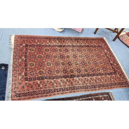 230 - Three hand woven rugs to include an Afghanistan small rug, 117cm x 55cm, a Balouch design rug, 138cm... 