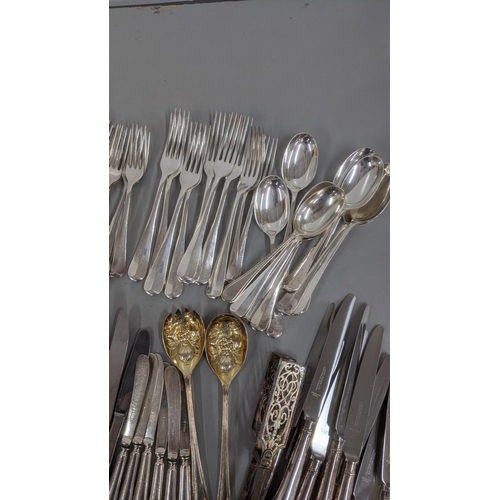 241 - A quantity of various silver plated flatware and cutlery along with asparagus servers and other item... 