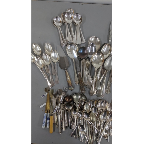 241 - A quantity of various silver plated flatware and cutlery along with asparagus servers and other item... 