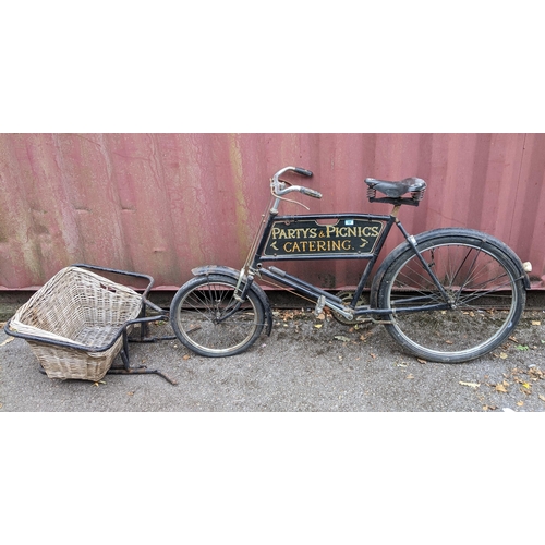 250 - A vintage Butcher's bicycle, black painted frame, with advertising sign for Hocket and Pocket High S... 