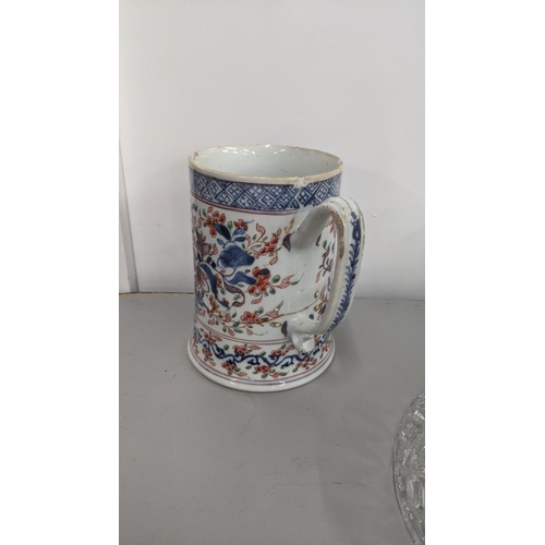 272 - An 18th century Chinese clobbered tankard decorated with a floral design, A/F
Location: 4-1
If there... 