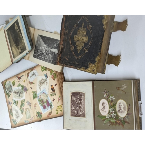 303 - A mixed lot to include a Victorian photograph album, a Victorian scrap book with Christmas cards and... 