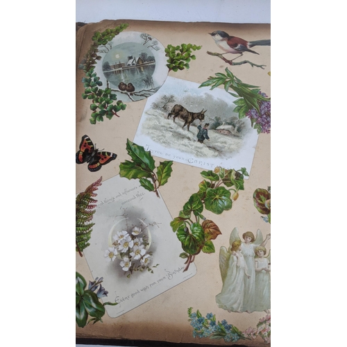 303 - A mixed lot to include a Victorian photograph album, a Victorian scrap book with Christmas cards and... 