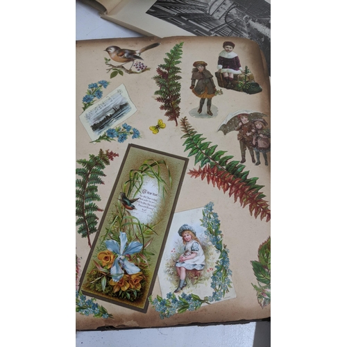 303 - A mixed lot to include a Victorian photograph album, a Victorian scrap book with Christmas cards and... 