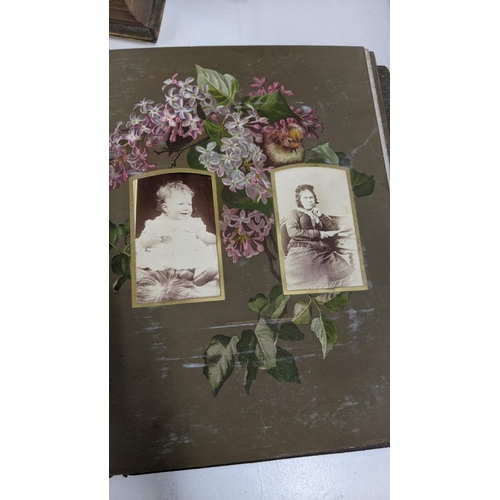 303 - A mixed lot to include a Victorian photograph album, a Victorian scrap book with Christmas cards and... 