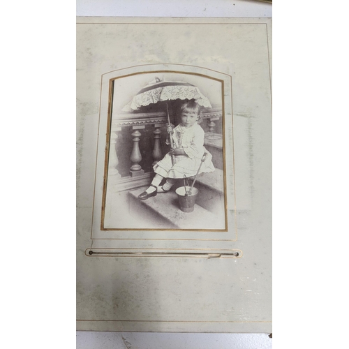 303 - A mixed lot to include a Victorian photograph album, a Victorian scrap book with Christmas cards and... 