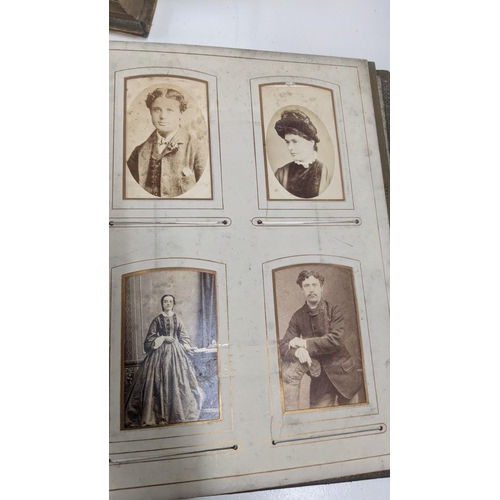 303 - A mixed lot to include a Victorian photograph album, a Victorian scrap book with Christmas cards and... 