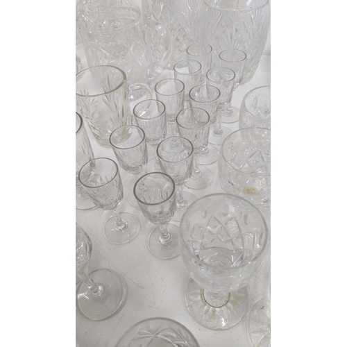 304 - Early 20th century and later glassware to include a pair of crystal cut glass decanters together wit... 