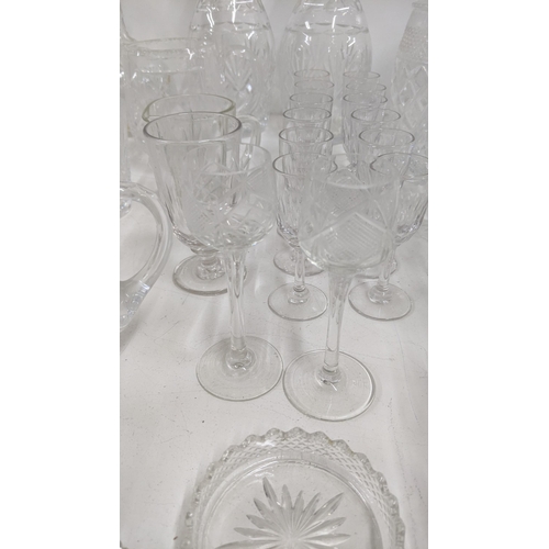 304 - Early 20th century and later glassware to include a pair of crystal cut glass decanters together wit... 