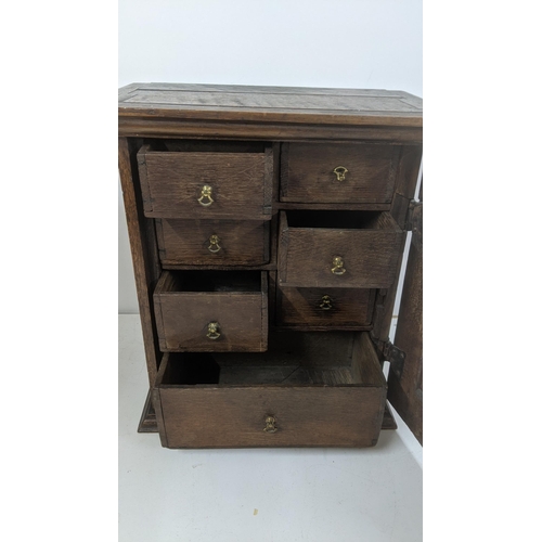 312 - An 18th century and later oak table top cabinet fitted with drawers 44cm H x 39cm W, 22cm deep

Loca... 