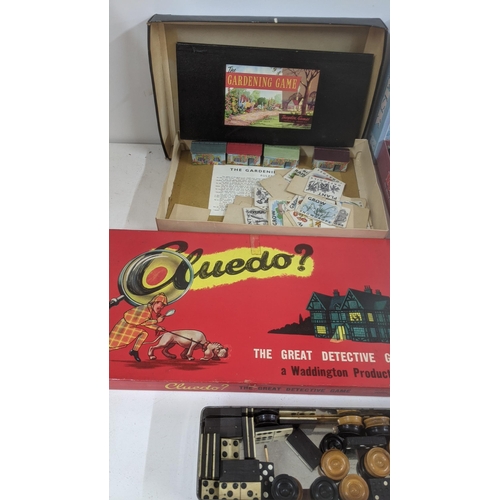 313 - A group of vintage board games to include Cluedo by John Waddington and others together with wood an... 