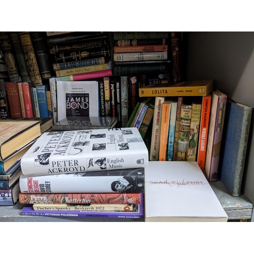 38 - A collection of books, mainly novels and biographies, some signed to include Simon Scarrow and Micha... 