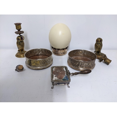 41 - A mixed metalwares and an Ostrich egg, to include a pair of Victorian brass figural candlesticks in ... 