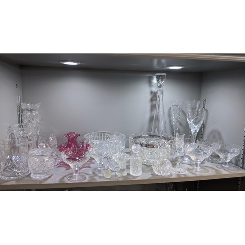 6 - A mixed lot of glassware to include crystal glass bowls, decanter vinegar jugs together with a decor... 