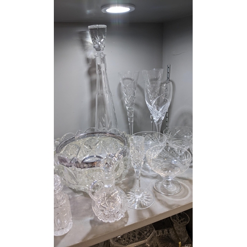 6 - A mixed lot of glassware to include crystal glass bowls, decanter vinegar jugs together with a decor... 