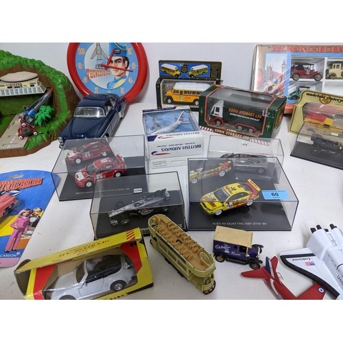 60 - Toys to include a Thunderbirds Tracey Island, with figures and vehicles to include a Thunderbirds 2,... 