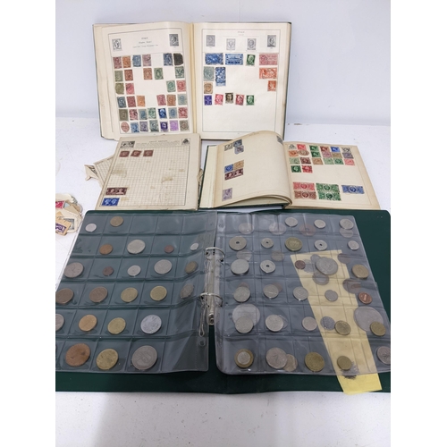 67 - A collection of world stamps and coins, held mainly in three albums, to include GB and Italy stamps ... 