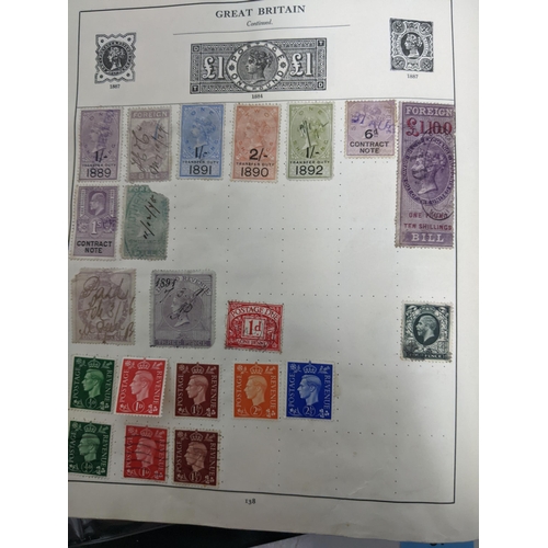 67 - A collection of world stamps and coins, held mainly in three albums, to include GB and Italy stamps ... 