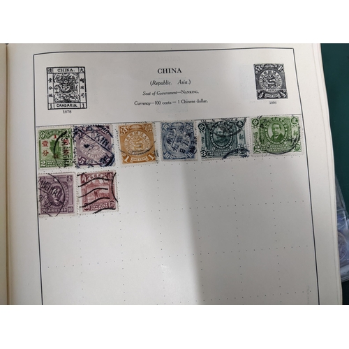 67 - A collection of world stamps and coins, held mainly in three albums, to include GB and Italy stamps ... 