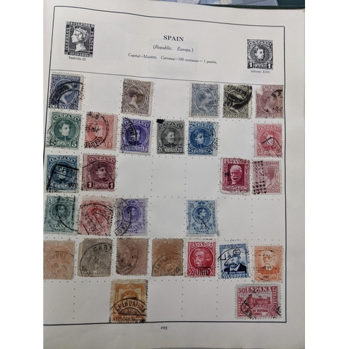 67 - A collection of world stamps and coins, held mainly in three albums, to include GB and Italy stamps ... 