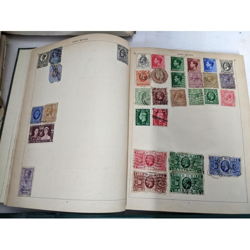 67 - A collection of world stamps and coins, held mainly in three albums, to include GB and Italy stamps ... 