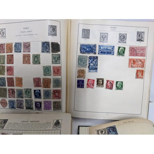 67 - A collection of world stamps and coins, held mainly in three albums, to include GB and Italy stamps ... 