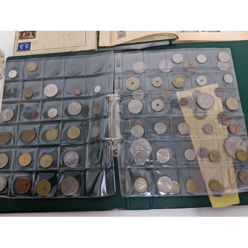 67 - A collection of world stamps and coins, held mainly in three albums, to include GB and Italy stamps ... 