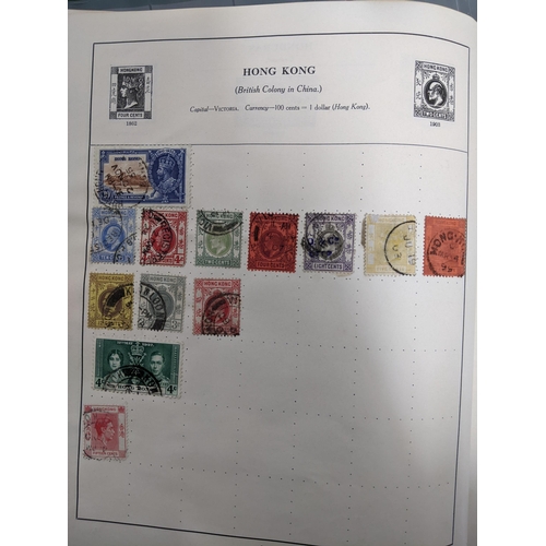 67 - A collection of world stamps and coins, held mainly in three albums, to include GB and Italy stamps ... 