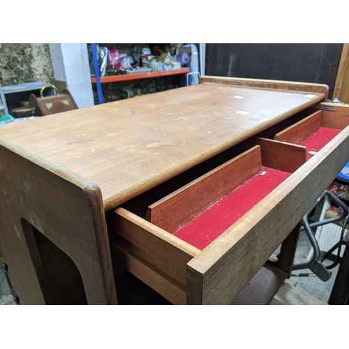 75 - A H McIntosh & Co Ltd mid-century teak tea trolley, cutlery drawer to top shelf below two further sh... 