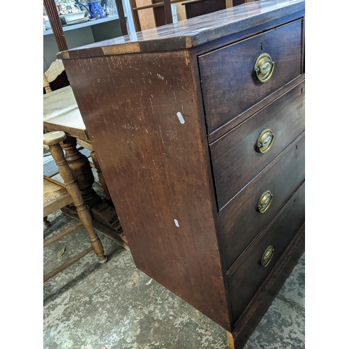 78 - A Georgian mahogany flat fronted chest of two short and three long graduated drawers on plinth base ... 