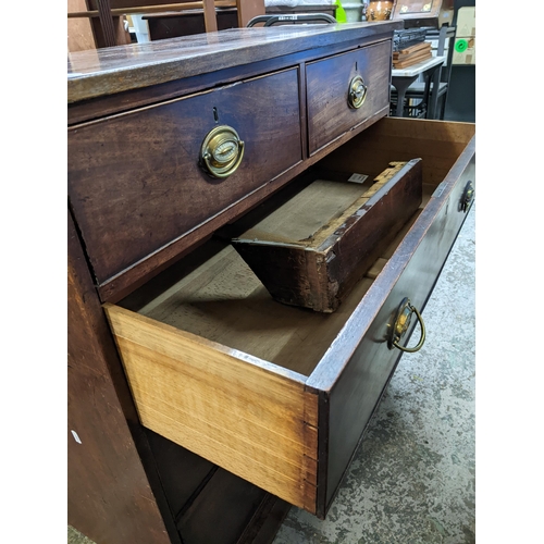 78 - A Georgian mahogany flat fronted chest of two short and three long graduated drawers on plinth base ... 