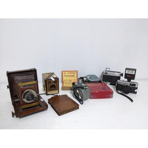 83 - A selection of vintage cameras to include Bawer 88c, Brownie flash B, folout example and plates
Loca... 