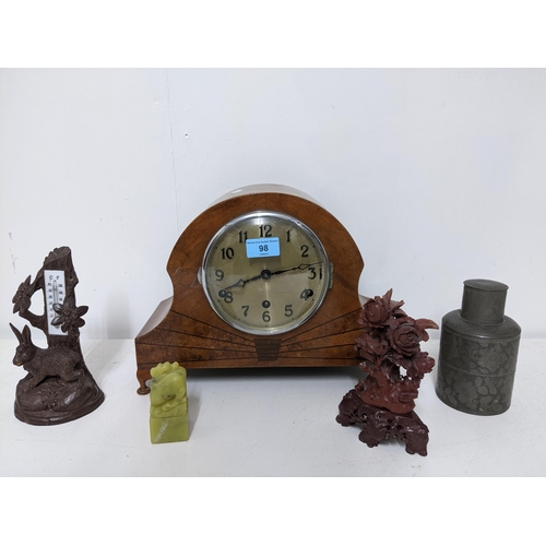 98 - A mixed lot to include an Art Deco period inlaid walnut cased mantel clock, Black Forest carved ther... 